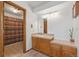 Clean bathroom with wood cabinets and shower/tub combo at 10101 W 72Nd Ave, Arvada, CO 80005