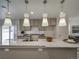 Modern kitchen with granite countertops and pendant lighting at , Commerce City, CO 80022