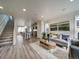 Open concept living area showcasing kitchen, stairs, and living room at , Commerce City, CO 80022