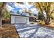 Two-story house with a two car garage and fall foliage at 4716 Berkshire Ct, Boulder, CO 80301