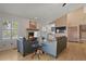 Living room with fireplace and seating area, hardwood floors at 1678 S Rosemary St, Denver, CO 80231