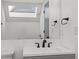 Bright bathroom with vanity, sink, and mirror at 8701 Huron St # 10-210, Thornton, CO 80260