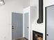 Entryway with gray door and wood floor at 8701 Huron St # 10-210, Thornton, CO 80260