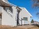 Side view of building showing entrance and stairs at 8701 Huron St # 10-210, Thornton, CO 80260