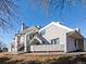 Exterior view of building showcasing stairs and siding at 8701 Huron St # 10-210, Thornton, CO 80260