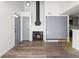 Living room with fireplace and wood floor at 8701 Huron St # 10-210, Thornton, CO 80260