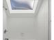 Clean shower with white tile and skylight at 8701 Huron St # 10-210, Thornton, CO 80260
