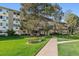 Attractive exterior of a multi-unit building with landscaping and walkway at 725 S Alton Way # 3B, Denver, CO 80247