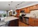 Modern kitchen with stainless steel appliances and island at 725 S Alton Way # 3B, Denver, CO 80247