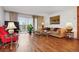 Bright living room with hardwood floors, large windows, and comfortable seating at 725 S Alton Way # 3B, Denver, CO 80247