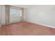 Spacious bedroom with neutral carpeting and a large window at 725 S Alton Way # 3B, Denver, CO 80247