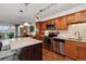 Modern kitchen with stainless steel appliances and island at 725 S Alton Way # 3B, Denver, CO 80247