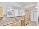 Kitchen with breakfast bar and ample counter space at 7931 W 55Th Ave # 112, Arvada, CO 80002