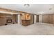 Finished basement recreation room with wet bar, fireplace, and ample space at 16720 E Layton Ave, Aurora, CO 80015