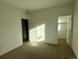 Bright bedroom with carpet and a walk-in closet at 14585 W 91St Ave # D, Arvada, CO 80005