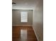 Bedroom with hardwood floors and polka dot wall at 2889 S Newark Pl, Aurora, CO 80014
