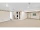 Finished basement with carpeted floor, and built-in shelving at 2577 S Eagle Cir, Aurora, CO 80014