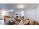 Spacious finished basement Gathering room with comfortable seating at 12276 W Tennessee Pl, Lakewood, CO 80228