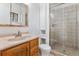 Bathroom with shower and wood vanity at 16812 E Mansfield Cir, Aurora, CO 80013