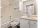 Clean bathroom featuring a bathtub, toilet, and vanity with storage at 16812 E Mansfield Cir, Aurora, CO 80013