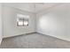 Bright bedroom with carpet flooring and a window offering natural light at 16812 E Mansfield Cir, Aurora, CO 80013