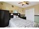 Bedroom with ceiling fan, closet, and gray bedding set at 384 Woodson Dr, Erie, CO 80516