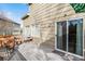 Back deck with seating area and sliding glass door at 384 Woodson Dr, Erie, CO 80516