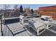 Private rooftop deck with modern furniture and city views at 3135 W 25Th Ave, Denver, CO 80211