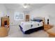 Cozy bedroom with ceiling fan, wood furniture, and ample closet space at 1618 S Kenton St, Aurora, CO 80012