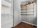 Unfinished basement with shelving and storage at 317 Delaware St, Denver, CO 80223