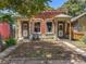 Charming brick duplex with inviting front porches and well-maintained landscaping at 317 Delaware St, Denver, CO 80223