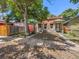 Brick duplex with mature trees and sidewalk at 317 Delaware St, Denver, CO 80223