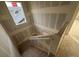 Unfinished staircase with drywall and wood railing at 2271 Serenidad St, Brighton, CO 80601