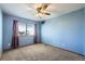 Bedroom with carpet, ceiling fan and window at 6464 S Swadley Way, Littleton, CO 80127