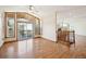 Living room with hardwood floors, access to deck, and staircase at 2203 S County Road 185, Byers, CO 80103