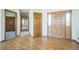 Hardwood floors and multiple doors in the entryway at 2203 S County Road 185, Byers, CO 80103