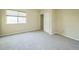Bright bedroom with neutral carpeting and ample space at 2203 S County Road 185, Byers, CO 80103