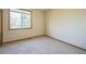 Spacious bedroom featuring a window and neutral wall tones at 2203 S County Road 185, Byers, CO 80103