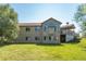 Two-story house with large windows and a spacious deck at 2203 S County Road 185, Byers, CO 80103