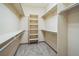 Large walk-in closet with hanging rods and shelves at 2203 S County Road 185, Byers, CO 80103