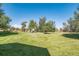 Large backyard with playground and mature trees at 2203 S County Road 185, Byers, CO 80103