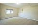 Finished basement bedroom with neutral carpeting at 2203 S County Road 185, Byers, CO 80103