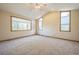 Spacious main bedroom with large windows and carpeted floor at 2203 S County Road 185, Byers, CO 80103