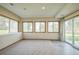 Finished basement with large windows and patio access at 2203 S County Road 185, Byers, CO 80103