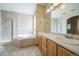 Bathroom with double sinks, soaking tub, and shower at 2203 S County Road 185, Byers, CO 80103