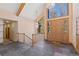 Bright and spacious entryway with a dramatic staircase and wood floors at 17820 Pinto Way, Monument, CO 80132