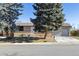 Ranch style home with mature trees and a two-car garage at 6572 S Dover St, Littleton, CO 80123