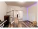 Open hallway with mirrored doors and access to other rooms at 10303 Pitkin Ct, Commerce City, CO 80022