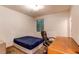 Basement bedroom with a desk, chair, and double bed at 10303 Pitkin Ct, Commerce City, CO 80022