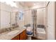 Bathroom with granite vanity, tub shower combo, and tile flooring at 10303 Pitkin Ct, Commerce City, CO 80022